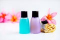 Toiletries with plumeria flower and towel