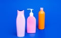 Toiletry and cosmetic plastic containers for liquid shower and bath products packing in row, bottles