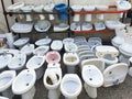 Toilets and sinks in a second-hand store