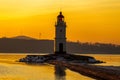 Tokarevsky lighthouse during a colorful dawn against the backdrop of a beautiful sea.