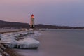Tokarevsky lighthouse during a colorful dawn against the backdrop of a beautiful sea.