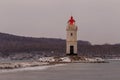 Tokarevsky lighthouse during a colorful dawn against the backdrop of a beautiful sea.