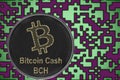 Token BitcoinCash BCH coin cryptocurrency on the background of gold crypto code