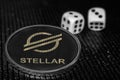 Token cryptocurrency Stellar XLM and rolling dice. Royalty Free Stock Photo