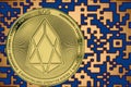 Token EOS coin cryptocurrency on the background of gold crypto code Royalty Free Stock Photo