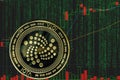 Token iota miota cryptocurrency on the background of binary crypto matrix text and price chart.