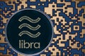 Token libra coin cryptocurrency on the background of gold crypto code