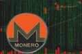 Token xmr monero cryptocurrency on the background of binary crypto matrix text and price chart.