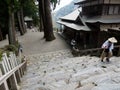 Buddhist pilgrim climbing the stairs of Shosanji, temple number 12 of Shikoku pilgrimage