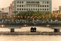 Tokushima, Japan - August 12, 2022: Small boat passes under crowded bridge at Awaodori Festival