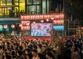 Broadcast screen aside crowd at Anime Song Bon Odori Dance Festival of Kanda Myojin Shrine in Akihabara.