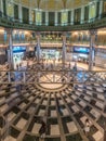 Motion blurred people conmuting and stainless steel columns at Tokyo Station Marunouchi building. Royalty Free Stock Photo