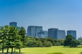 Marunouchi district skyline from Imperial Palace East Gardens Ninomaru on a summer clear morning Royalty Free Stock Photo