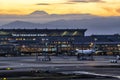 Tokyo Haneda Airport with Fuji mountain background at Sunset, Tokyo, Japan Royalty Free Stock Photo