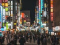 TOKYO, JAPAN - APR 12, 2019 : Shinjuku Shopping street Colourful Neon sign Shop Bar Restaurant Crowd people, Tokyo Japan nightlife