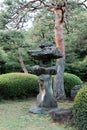 Japanese style stone lantern in Shinjuku Gyoen National Garden