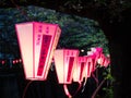 Paper lanterns lit at night during cherry blossom festival on Meguro river Royalty Free Stock Photo