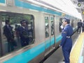 TOKYO, JAPAN - APRIL, 19, 2018: platform guard at a train station in tokyo Royalty Free Stock Photo