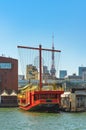 Gozabune sailboat replica moored in Tokyo bay with the Tokyo tower. Royalty Free Stock Photo