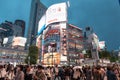 View of Shibuya Crossing, one of the busiest crosswalks in the world in a raining day