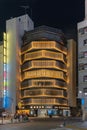 Yasuyo building in Shinjuku designed with illuminated shapes of stacked bolts at night. Royalty Free Stock Photo