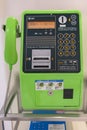 Japanese green NTT public telephone at a phone booth maintain as universal service system. Royalty Free Stock Photo