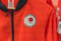 Closeup on the chest of the sunrise red color official T-shirt of the Japan Paralympic Team.