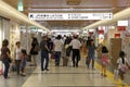 Crowded of Japanese people in tokyo train station on prime time with sign directions , Tokyo