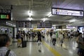 Crowded of Japanese people in tokyo train station on prime time with sign directions , Tokyo
