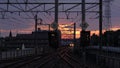 Keio Railway train arriving at Keio Tama Center Station at sunrise