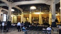 people praying inside the Tsukiji Honganji Jodo Shinshu Buddhist temple, Tokyo, Japan.