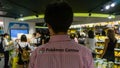 Unidentified Pokemon Center sales person with Pokemon shirt in Pokemon Center in Tokyo, Japan