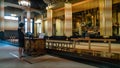 Unidentified woman praying inside the Tsukiji Honganji Jodo Shinshu Buddhist temple, Tokyo, Japan Royalty Free Stock Photo