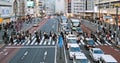 Car traffic transportation, Japanese people, crowd Asian commuter walk cross road in Shinjuku Tokyo Japan Royalty Free Stock Photo