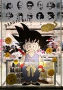 Japanese anime and manga character Son Goku from Dragon ball on a giant sticker in Harajuku.