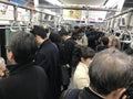 Inside a Crowded Commuter Train Car During Peak Hours in Tokyo Royalty Free Stock Photo