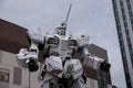 Gundam moving robot statue in Odaiba performing show at sunset