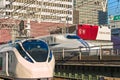 Limited express train and Shinkansen bullet train beside Tokyo Sports Square. Royalty Free Stock Photo