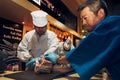 Tokyo, Japan - February 7, 2022 : japanese butchers are cutting and decorating highest meat grade of marbling A5 japanese wagyu
