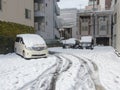 Tokyo, Japan - February 9, 2014: snow covering cars parked after blizzard in tokyo