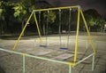 Vacant swing in a park at night in Tokyo