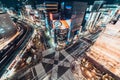 Tokyo, Japan - Jan 13, 2019: Cityscape aerial night view of Ginza zebra crosswalk road intersection with car traffic