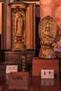 Wooden statue representing Buddha Amida Nyorai and Dainichi Nyorai in the Tennoji temple of Tendai Buddhism in the Yanaka cemetery Royalty Free Stock Photo