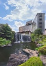 Big waterfall and Japanese koi carps at foot of the Hotel New Otani.