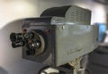 Close up on an old multi lenses television camera used in fifties broadcast media studio.