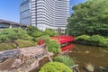 Japanese Taikobashi bridge crossing the pond of the Hotel New Otani Japanese Garden.