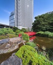 Japanese Taikobashi bridge crossing the pond of the Hotel New Otani Japanese Garden.