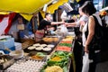 Tokyo, Japan - August 15, 2020 : senior japanese people are buying japanese fried noodle yakisoba from the food stall at street