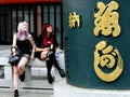 Two European girls dressed in modern clothing in a Tokyo temple