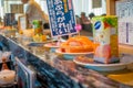 TOKYO, JAPAN -28 JUN 2017: Close up of assorted japanesse food over a table, inside of a kaitenzushi conveyor belt sushi